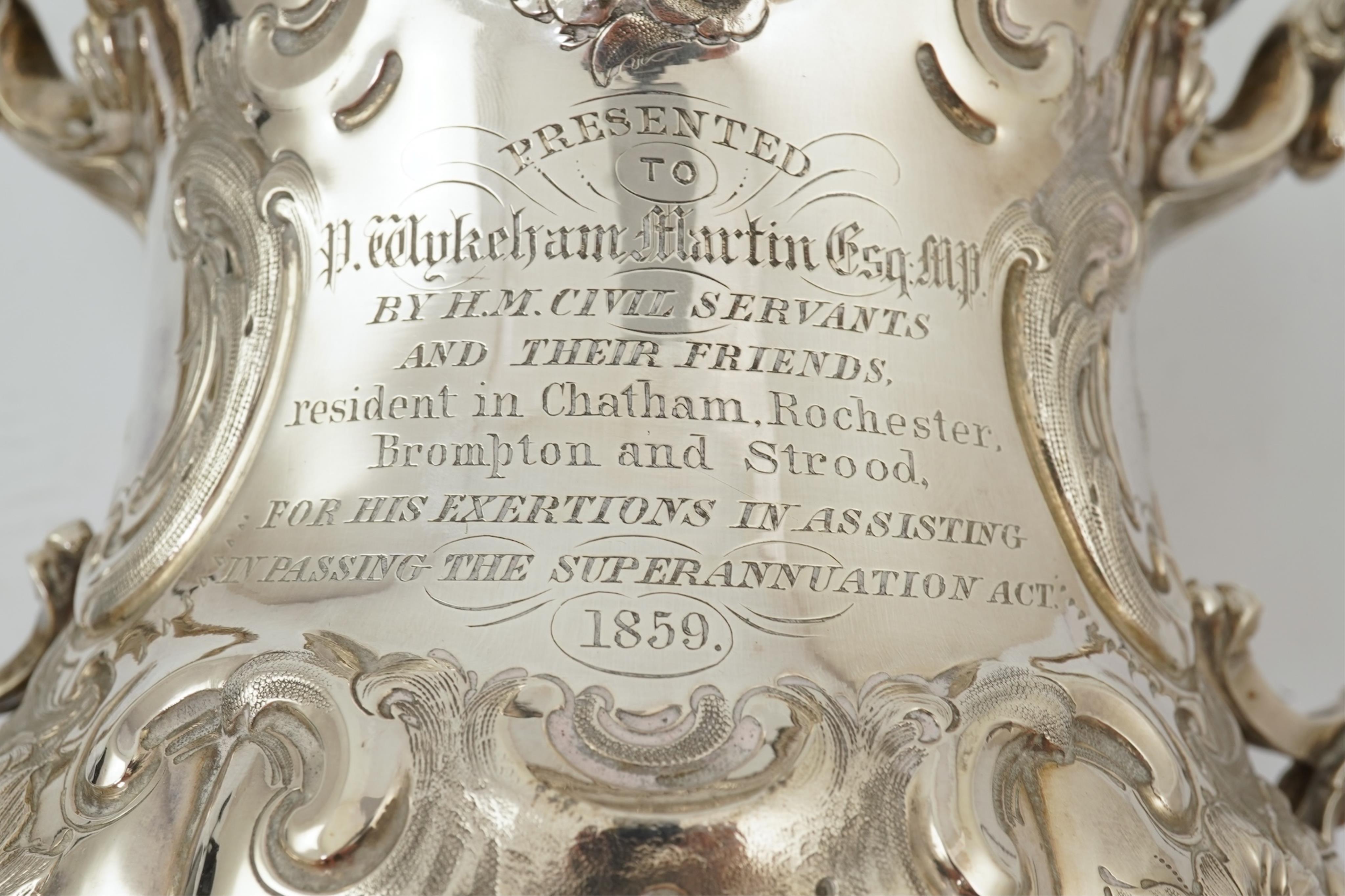 A Victorian embossed silver two handled presentation trophy cup by George John Richards & Edward Charles Brown